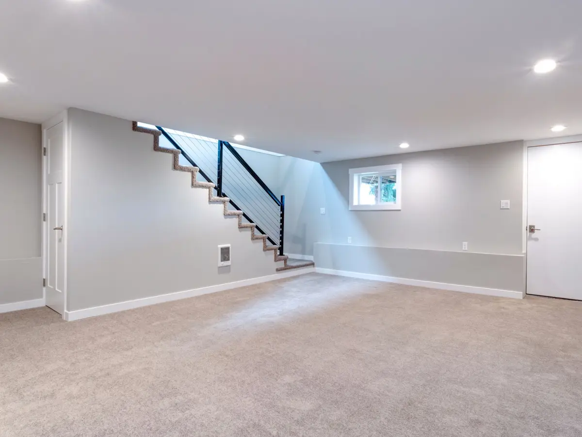 Dry finished basement with a staircase