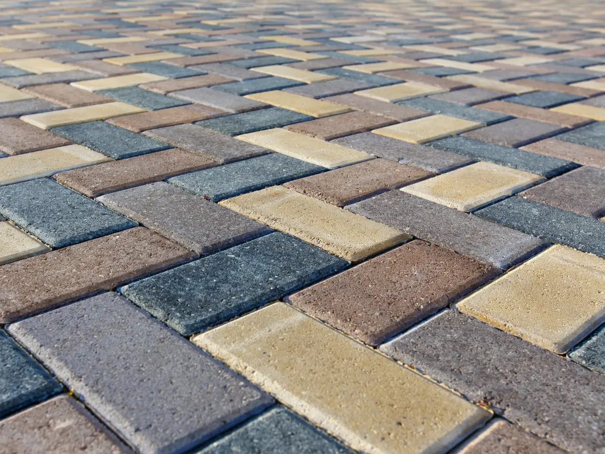 Interlocking pavers laid in a herringbone pattern