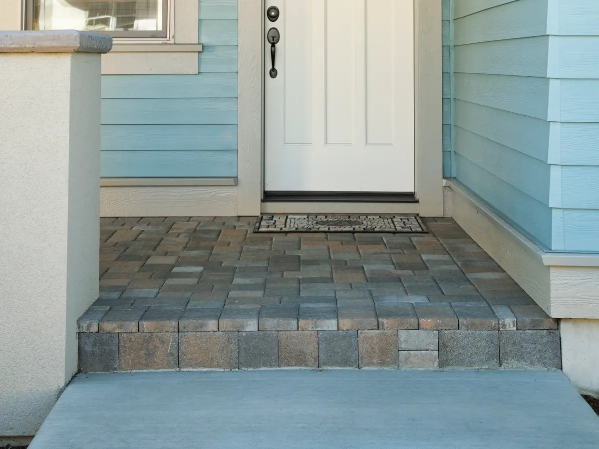 Paver step and landing at a front porch