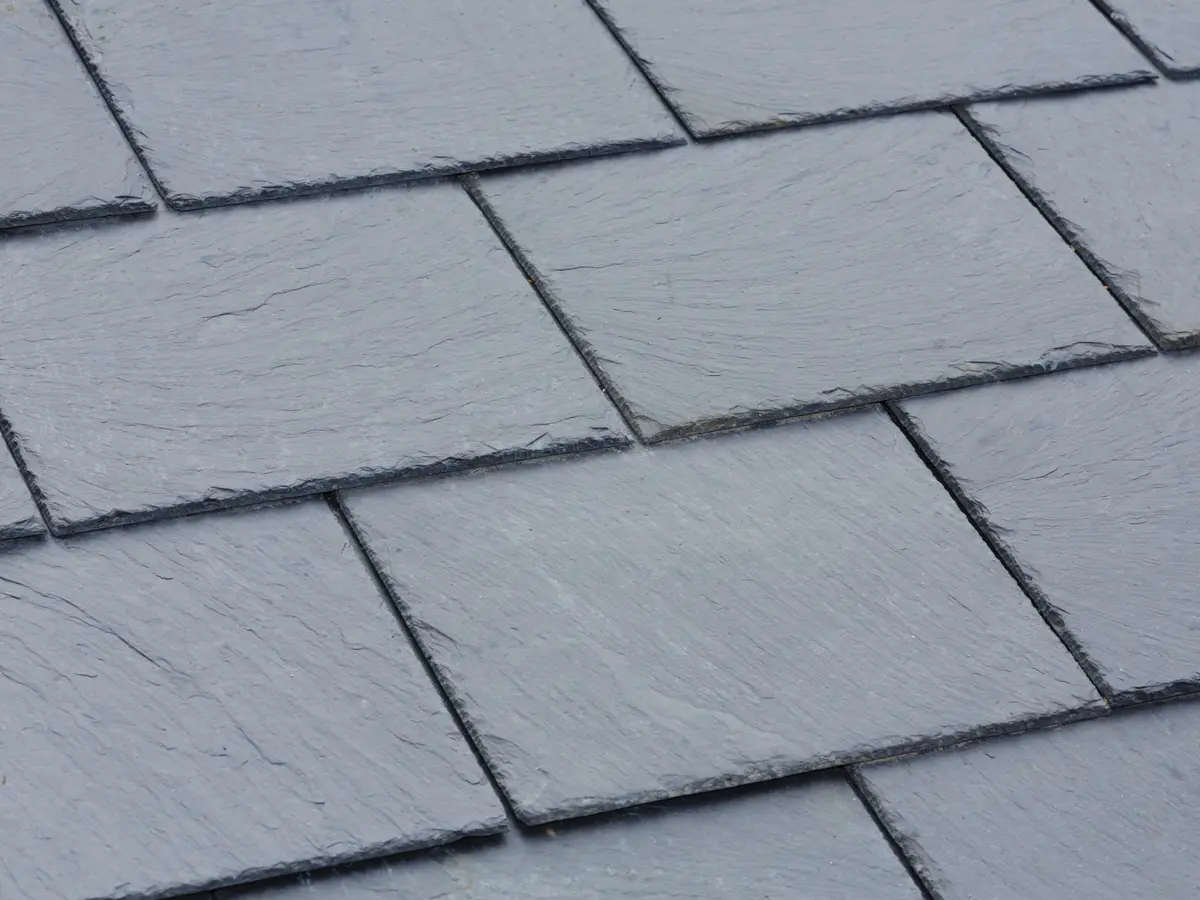 Close view of grey natural slates on a roof